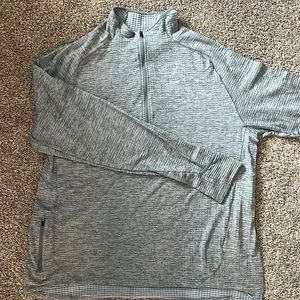 Nike Dri fit 1/4 zip. Thumb holes. Side zippered pocket. XL.